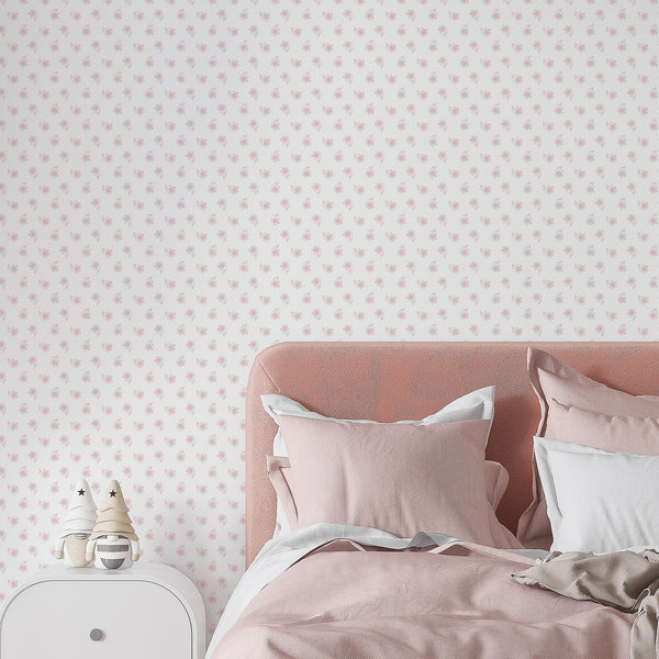 Hand drawn pink floral wallpaper with small delicate blossoms and a clean white background for feminine nursery, bedroom and girls room wall decor.