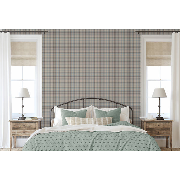 Dusty blue peel and stick wallpaper featuring a classic plaid check pattern with warm beige and muted brown accents for a cozy bedroom accent wall.