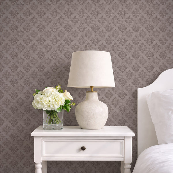 Symmetrical taupe damask pattern with soft floral rosettes, ideal for creating an accent wall in a traditional or modern farmhouse interior. This eco-friendly and temporary wall mural option is easy to apply and reposition, making it perfect for decorators and designers.