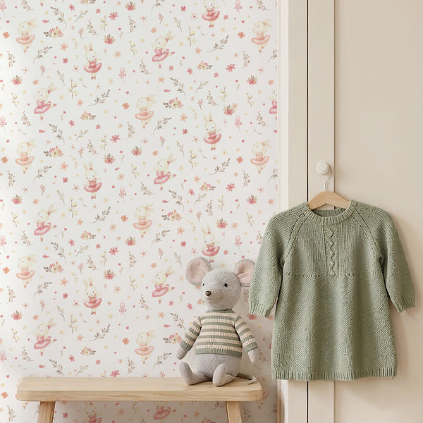 Pink rabbit nursery wallpaper with watercolor ballet artwork, dainty flowers, neutral foliage, and a light storybook style for a toddler room.