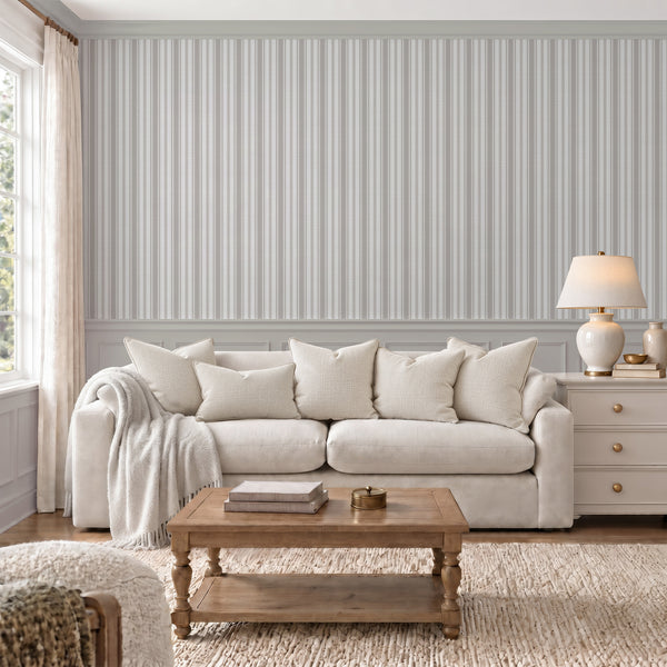 Classic beige gray striped wallpaper with repeating narrow vertical lines and subtle woven-style texture, perfect for English cottage and French country interiors.