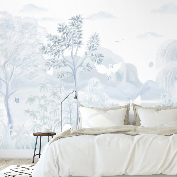 Soft blue nursery wallpaper featuring graceful swans, pastel woodland foliage, butterflies and distant hills in a delicate chinoiserie landscape.