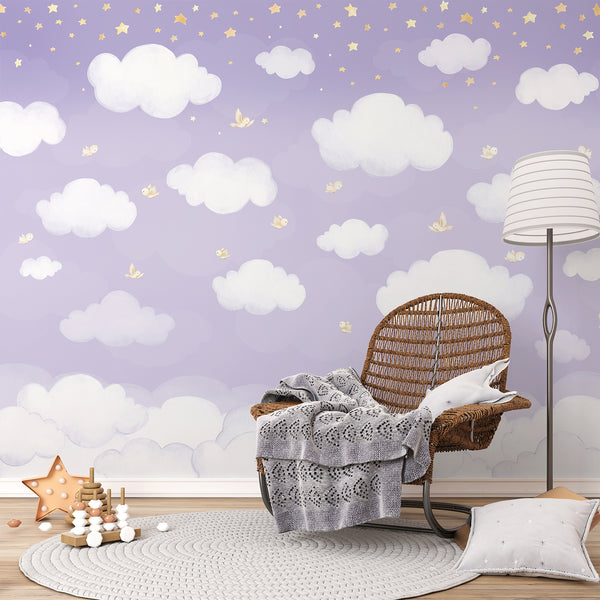 Dreamy lavender nursery wallpaper featuring layered white clouds, small flying birds and warm yellow stars against a soft pastel purple sky.