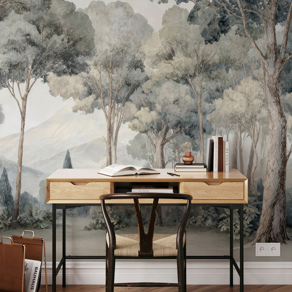 Soft watercolor forest mural with clouded canopies, creating a nature-forward living room accent wall. This eco-friendly, removable wallpaper is easy to apply and reposition.
