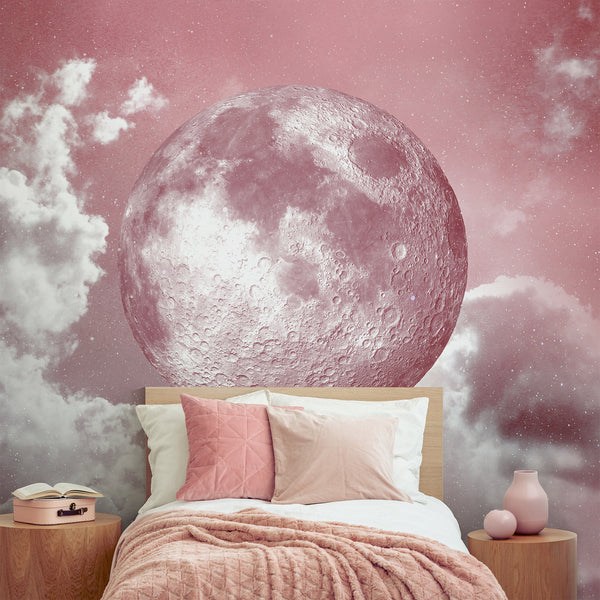 Large-scale moon mural with high-contrast crater details floating in a soft pink sky, surrounded by fine stars and clouds. This statement wall decor suits media rooms or girls' bedrooms, offering a dramatic, yet cozy atmosphere. Easy to reposition and made from eco-friendly materials, perfect for modern interior design.