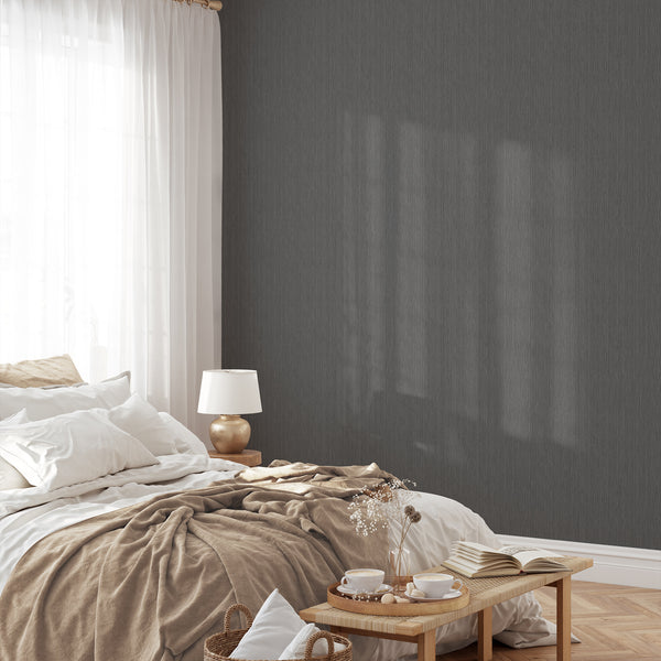 Charcoal and soft gray vertical textured wallpaper with subtle banding, ideal for creating depth in a serene bedroom. Easy to apply, self-adhesive, and made from eco-friendly materials.