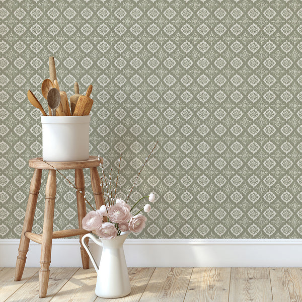 Traditional unpasted wallpaper with medallion motifs, adding a semi-dense grid pattern to a cottagecore bedroom.