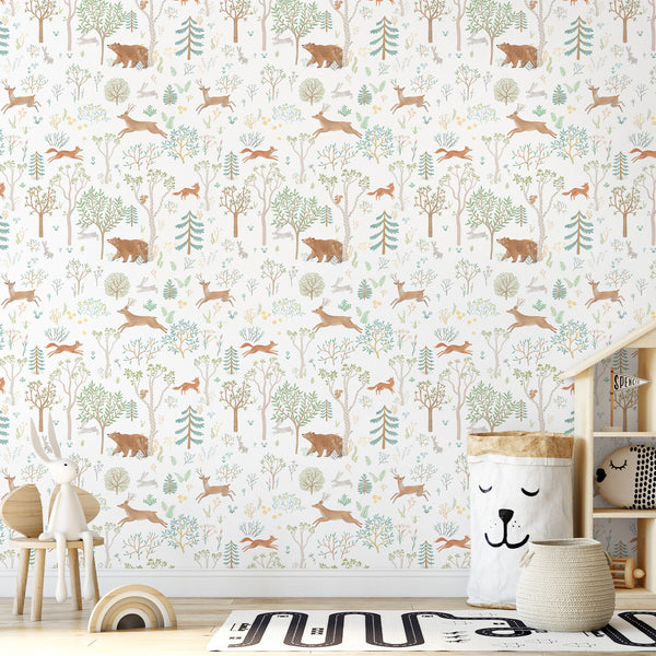 Densely repeated forest motifs in warm and cool tones provide a vibrant, rhythmic decor choice for kids' playrooms.