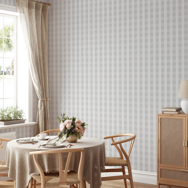 Farmhouse plaid wallpaper in light gray and white with refined intersecting stripes, creating a soft backdrop for living rooms and bedrooms.