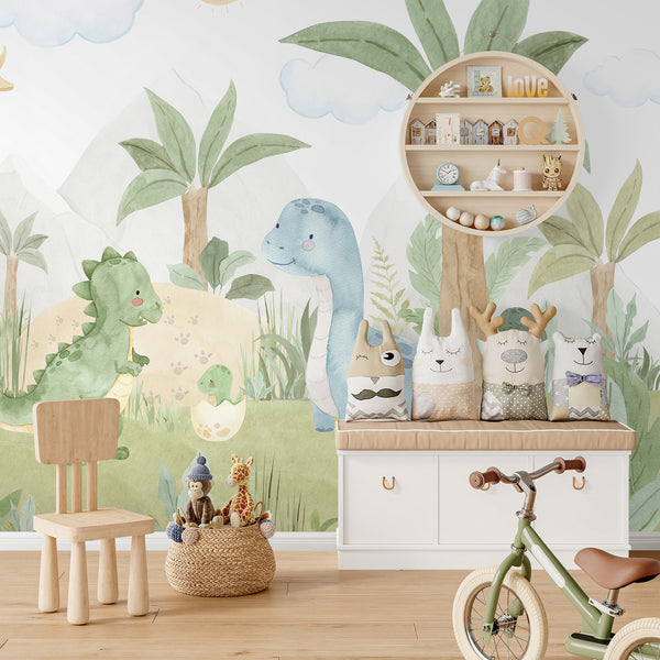 Soft watercolor dino wallpaper in green, blue and neutral tones with dinosaurs, tropical plants, mountains and clouds for cheerful nursery decor.