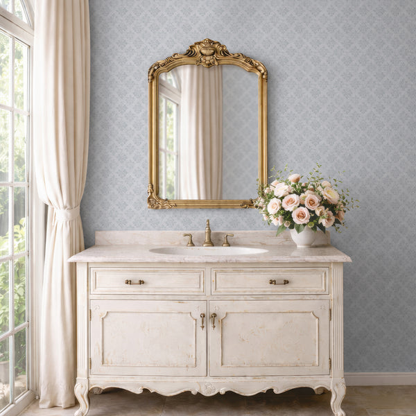 Soft gray-blue damask wallpaper with distressed edges, perfect for adding a vintage touch to modern farmhouse accent walls in hallways or entryways.