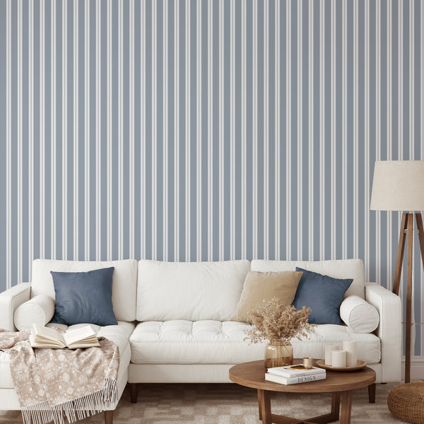 Blue pinstripe wallpaper featuring crisp white vertical stripes and fine linear accents for a minimalist bedroom, nursery, or modern home office.