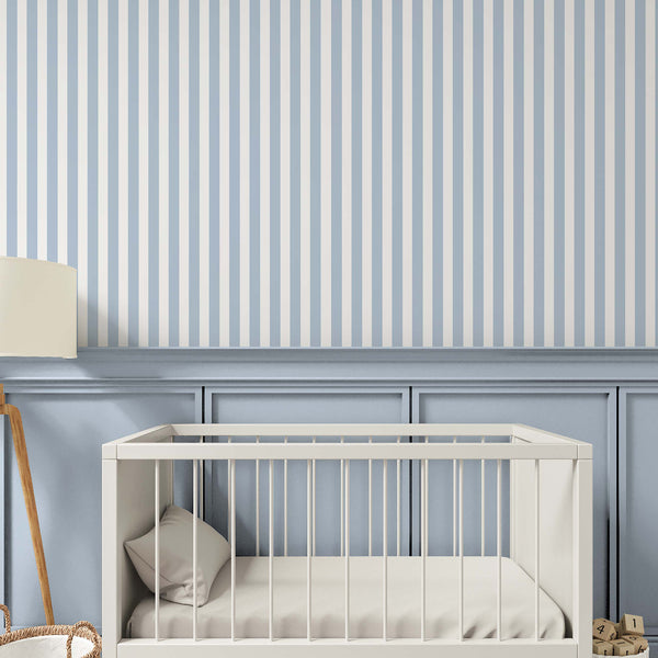 Pastel blue and white striped wallpaper featuring crisp, narrow vertical lines that create an elongating effect. Suitable for home offices or small feature walls, this self-adhesive wallpaper offers a seamless, easy-to-apply design. Made in the USA from high-quality materials, it adds a modern touch to any room while being eco-friendly and repositionable.
