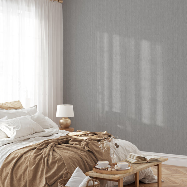 Cool mid-gray wallpaper with vertical lines creating a tall-scale rhythm, perfect for minimalist bedrooms or corridors seeking vertical emphasis.