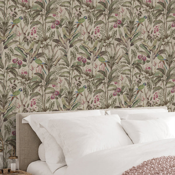 Vintage tropical wall mural with green parrots, soft pink flowers and layered exotic foliage for a botanical bedroom or living room accent wall.