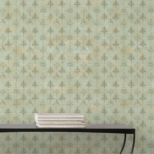 Antique style green wallpaper featuring faded damask patterns over a weathered textured surface for elegant French country and vintage interiors.