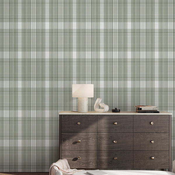 Neutral green plaid wallpaper with soft sage and cream checks, creating a structured yet cozy backdrop for a bedroom, office, nursery, or living room.