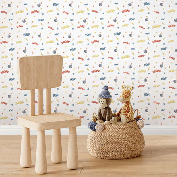 Superhero nursery wallpaper featuring hand-painted comic action motifs in black, gray, red, and yellow on a bright white background.
