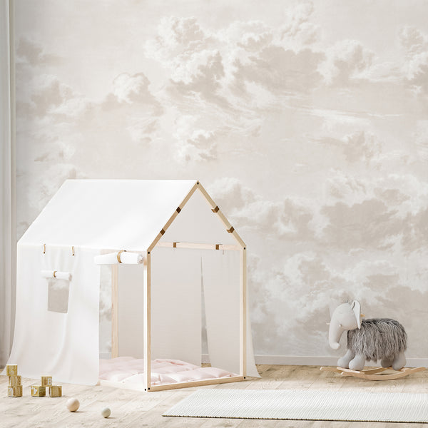 Soft beige cloud wallpaper with layered ivory and cream clouds, creating a dreamy neutral sky design for a nursery, bedroom, or kids room accent wall.