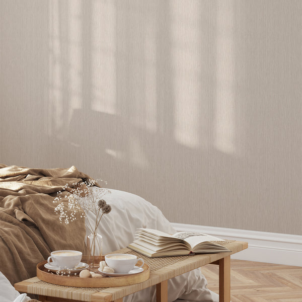 Sophisticated beige wallpaper with fine line strié patterns, providing a subtle linear grain for a refined living room accent wall. The warm beige tones and matte surface finish complement minimalist and Japandi interiors beautifully.