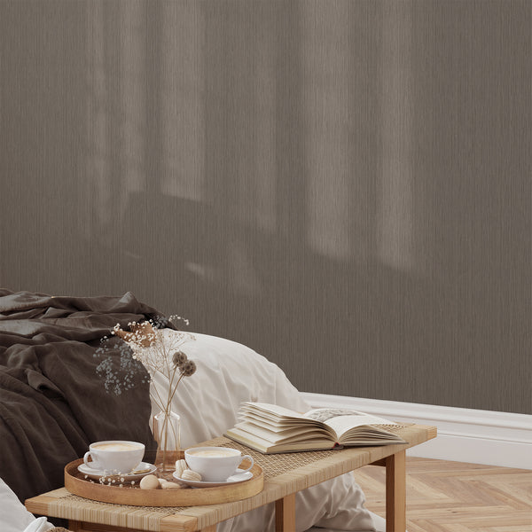 Narrow striation taupe wallpaper mimicking woven textures, ideal for enhancing height in hallways or bedrooms. Made in the USA, this high-quality peel and stick option is perfect for renters seeking a minimalist design with easy repositioning.