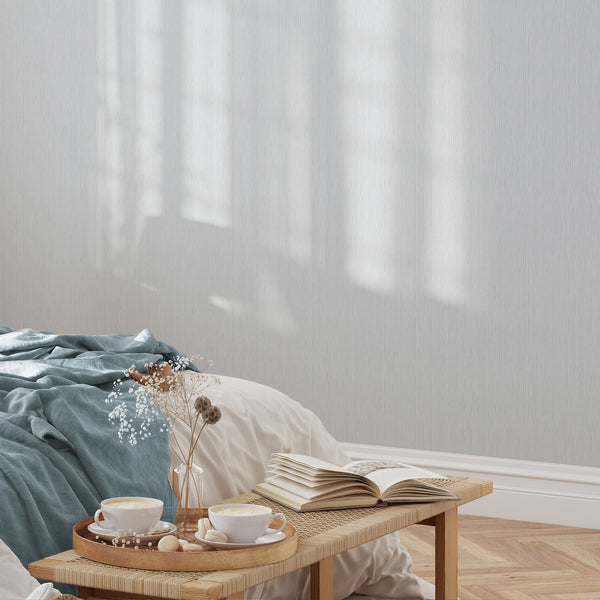 Elegant Light Blue Vertical Texture Wallpaper featuring subtle darker linear accents for a low-contrast vertical rhythm. Its dense, narrow motif makes it perfect for neutral grounds in living rooms or home offices, offering easy application and repositioning.