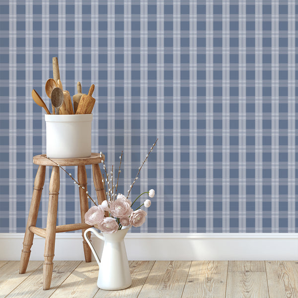 Coastal plaid wallpaper in navy blue and soft blue-gray with refined intersecting lines, creating a polished backdrop for bedrooms and living rooms.