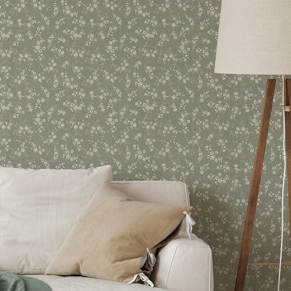 This Sage Green Floral Wallpaper combines tiny buds and daisylike heads on a dusty sage green background. The intimate, floral design is great for a temporary, self-adhesive wall covering in nurseries or cozy living spaces.