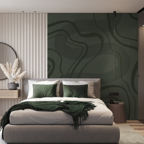 Minimalist green wall mural featuring sweeping dark olive lines and rich tonal shading for a moody contemporary bedroom accent wall.
