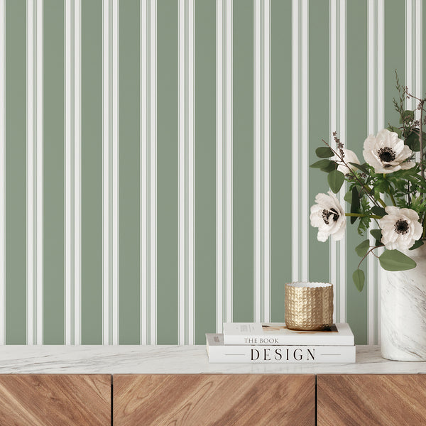 Muted green and white striped wallpaper with wide vertical bands and delicate pinstripe details for modern bedrooms, nurseries, and living rooms.