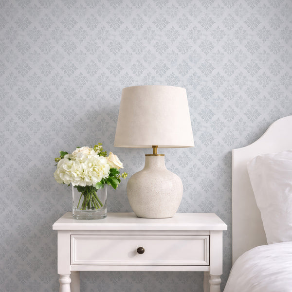 Elegant gray blue floral damask wallpaper with open spacing, enhancing a calm and airy feel, perfect for a welcoming hallway or cozy living room.