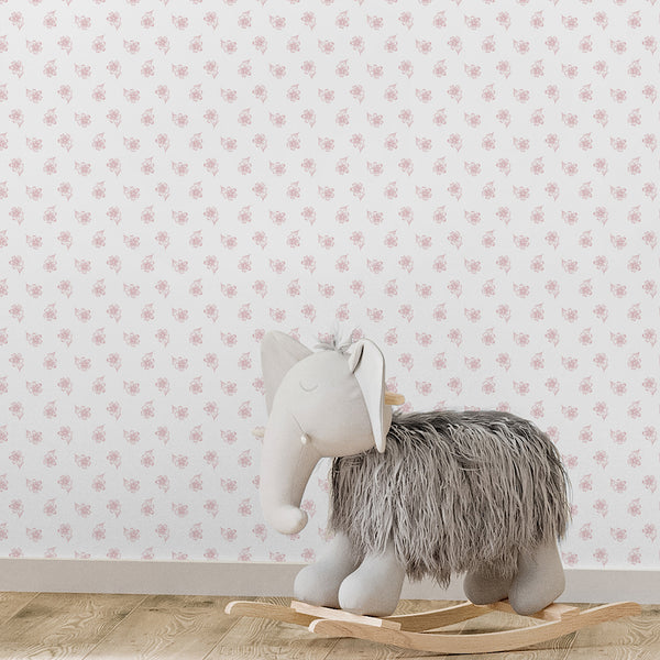 Minimalist flower wallpaper with dusty pink botanical sketches scattered over a white background, ideal for nursery, bedroom or powder room decor.