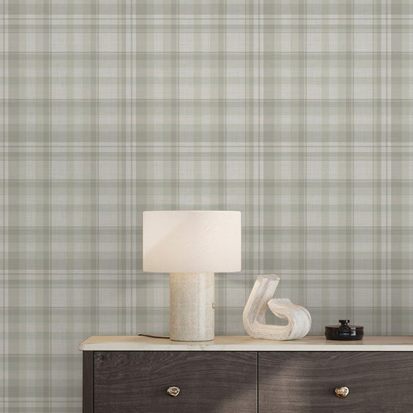 Removable light sage green plaid wallpaper featuring layered horizontal and vertical stripes with a subtle fabric-inspired texture for cozy farmhouse living rooms.