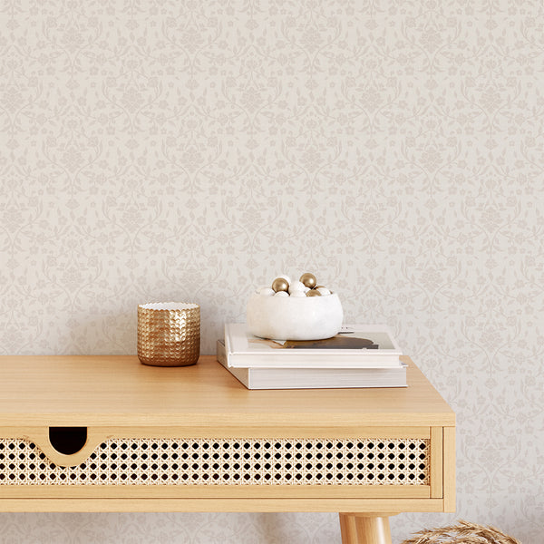 Neutral cottagecore damask wallpaper with pale cream blossoms and flowing floral branches on an off-white background, perfect for cozy bedroom accent walls.