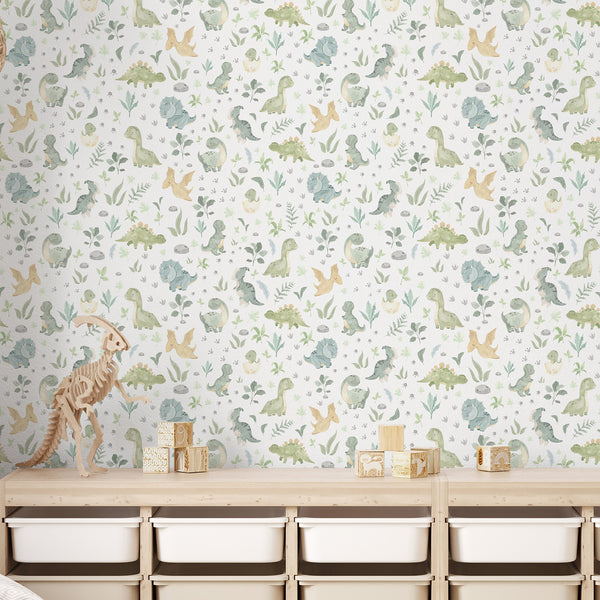 Playful dinosaur floral nursery wallpaper with watercolor dinos and delicate foliage on an off-white ground, creating a sweet, storybook look. Ideal for a modern or Scandinavian style nursery, offering removable peel and stick options for easy application.