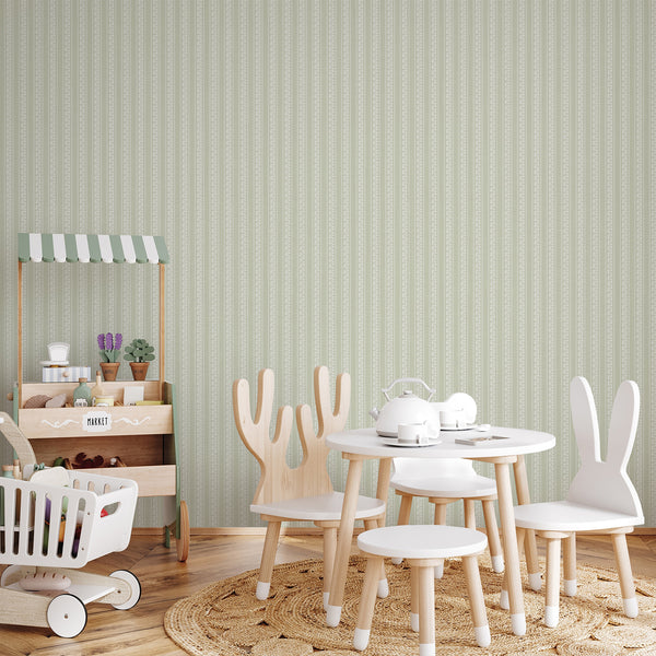 Botanical wall mural in sage green with delicate white flowers, repeating vertical stripe pattern, and timeless farmhouse style for nursery or bedroom decor.