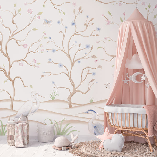 White chinoiserie wallpaper with graceful herons, flowering tree branches, colorful birds and butterflies in a delicate botanical landscape.