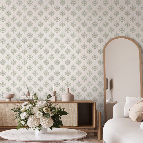 Neutral beige and sage green removable wallpaper showcasing elegant scrolling damask shapes and subtle aged texture for timeless living room decor.