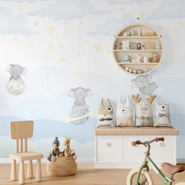 Whimsical mural with elephants and clouds offers a soft, calming atmosphere for nurseries. This high-quality removable design is eco-friendly and Made in the USA, providing an easy-to-apply option for decorators seeking a temporary, pastel-themed decor update for children's spaces.