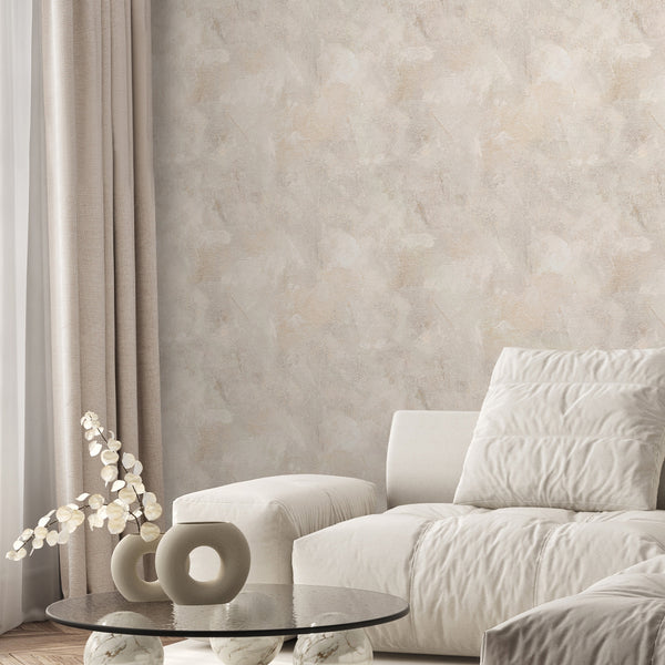Close-up of Beige Limewash Plaster Wallpaper showcasing broad trowel-like strokes and soft clouded patches in warm beige tones. Provides a matte, slightly grained canvas texture perfect for creating a serene atmosphere in hallways or home offices. Easy to apply and reposition, this temporary wallpaper is made in the USA from high-quality materials.
