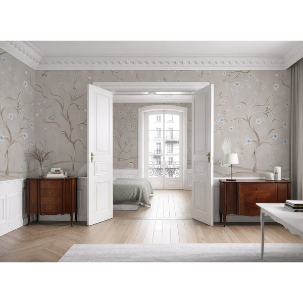 Beige floral wall mural featuring elegant heron birds, pastel blossoms, curved tree branches and delicate greenery in a soft chinoiserie inspired landscape.