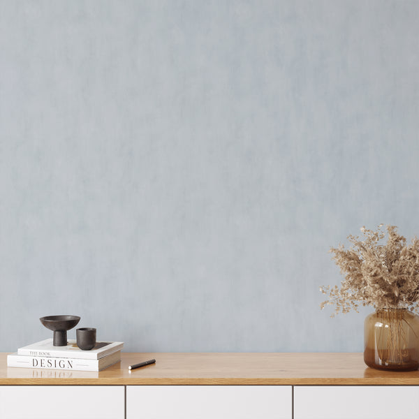Serene pale blue wall mural with limewash effect and non-directional texture, ideal for modern or Scandinavian bedrooms.