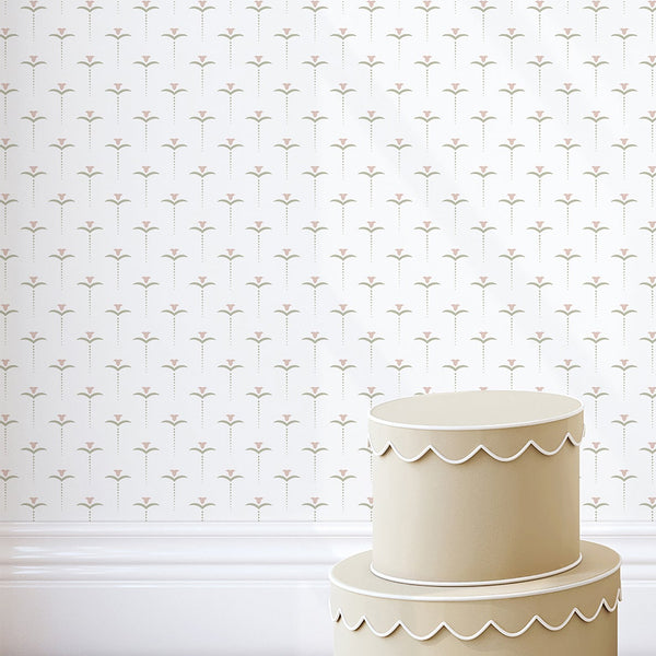 Minimalist pink and muted green floral wallpaper with small repeating stylized flowers and delicate dotted stems on a clean white background.