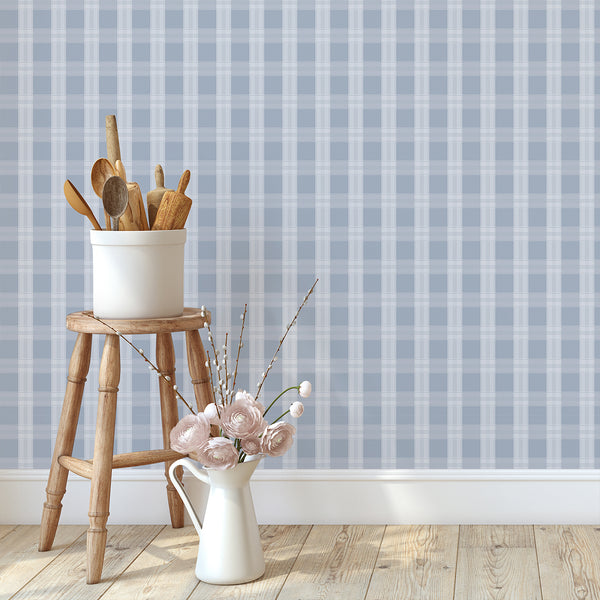 Preppy blue wallpaper featuring a large-scale check pattern with delicate white stripes for bedrooms, nurseries, offices, and stylish neutral interiors.