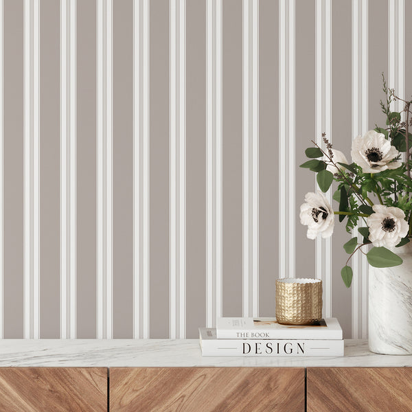 Taupe and white striped wallpaper with wide vertical bands and fine pinstripe details, creating a clean neutral look for bedrooms and living rooms.