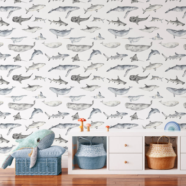 Watercolor ocean animals wallpaper featuring manta rays and narwhals in soft neutrals and ocean blues. Perfect for children's bedrooms and coastal living spaces, this self-adhesive wallpaper enhances nautical interiors with a calm and clean aesthetic. The printed surface mimics watercolor on smooth paper, offering a high-quality removable option.