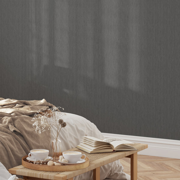 Dark gray wallpaper with narrow-scale vertical lines, adding quiet depth to a hallway. Pre-pasted wallpaper that is easy to apply and reposition, ideal for designers.