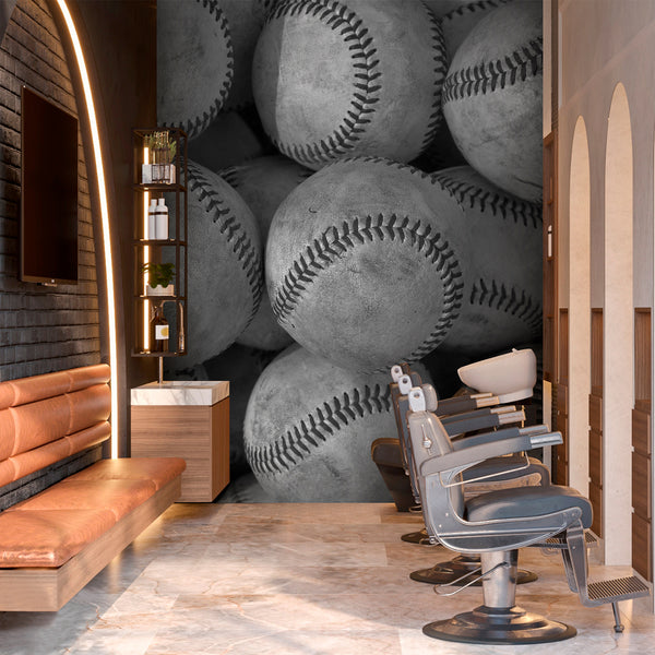 Gray baseball wall mural with overlapping weathered baseballs and bold black seams, creating a strong sports theme for a bedroom or game room.
