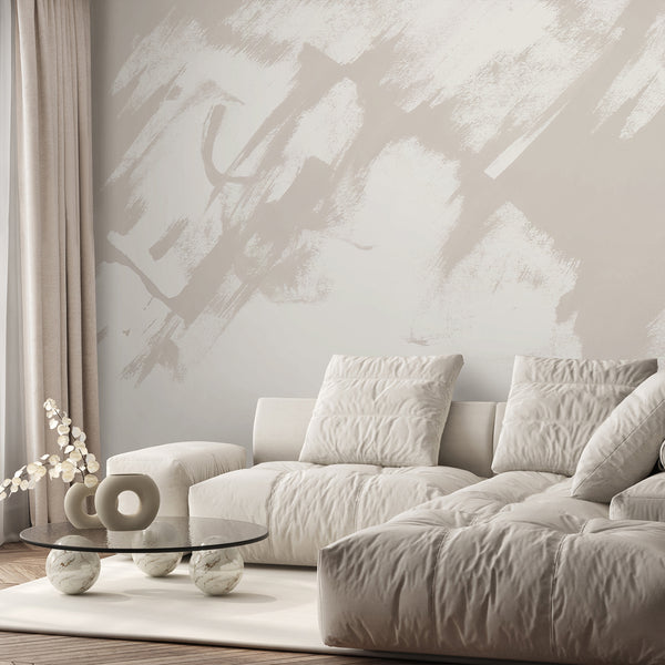 Neutral abstract wallpaper with large beige and white brush strokes creating a soft hand painted look for modern living room or bedroom wall decor.