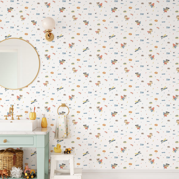 Superhero kids room wallpaper with watercolor boys and girls in colorful capes surrounded by stars, masks, bombs and comic action graphics.